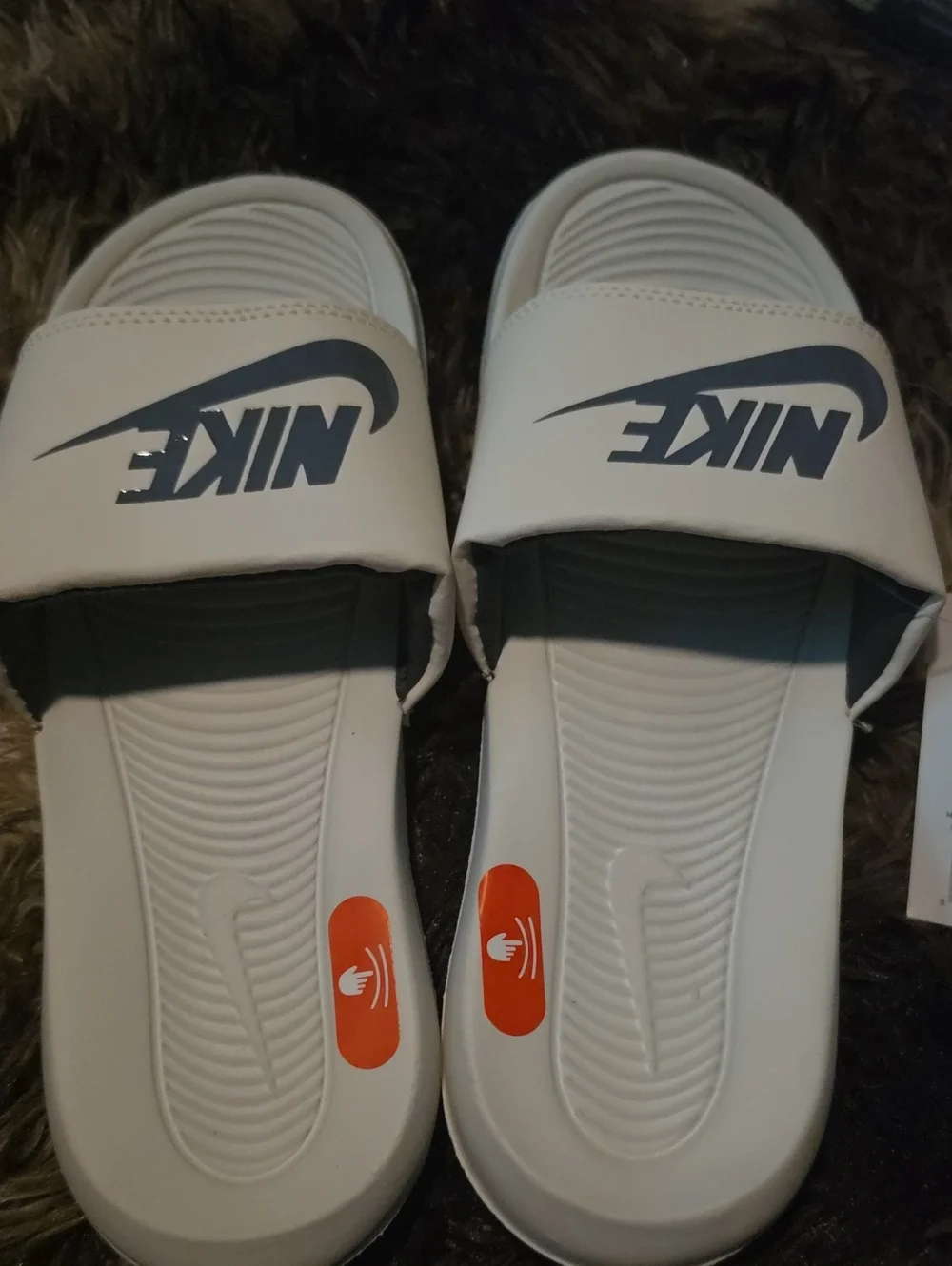 Nike Men’s White Slide Sandals with Black Logo and Orange Accents